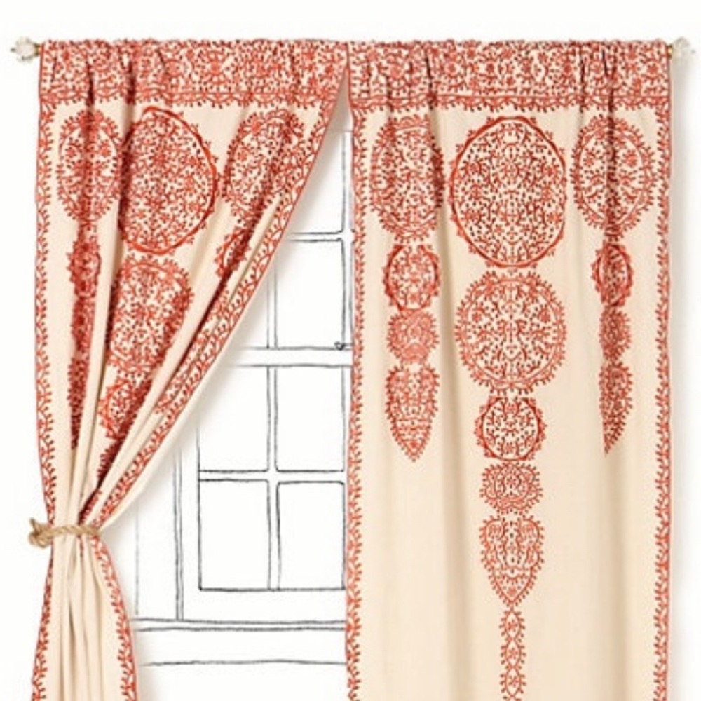 Anthropologie Marrakech curtain in rust-colored design